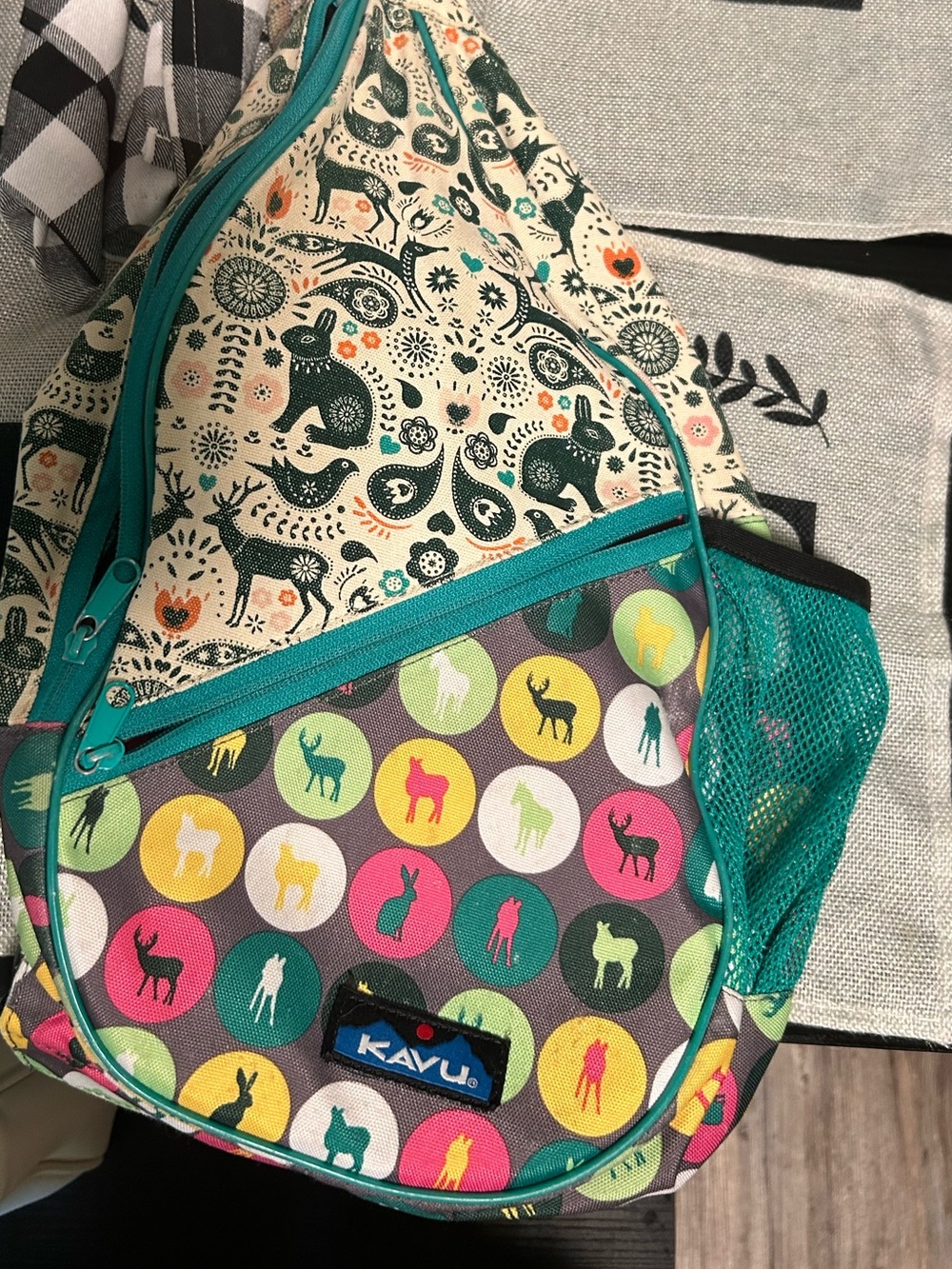 Kavu Teal Trim Multicolor Animal Dot Sling Pack